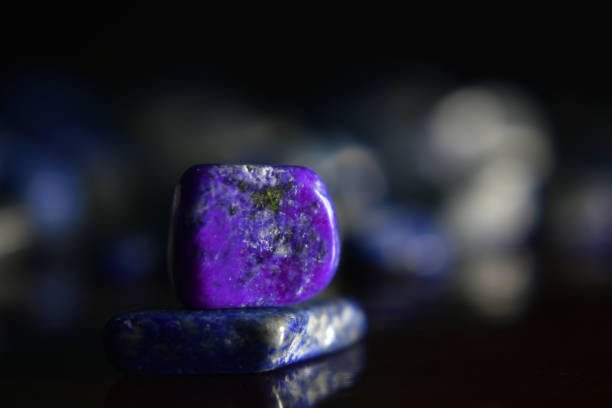 istock Lapis Is a beautiful natural gemstone on a wooden floor 1264166712