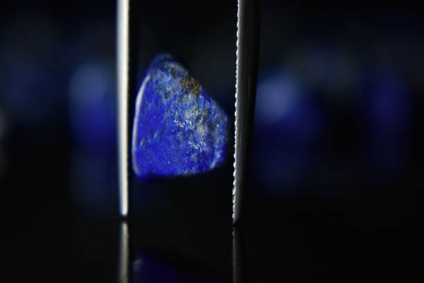 istock Lapis Is a beautiful natural gemstone on a wooden floor 1264166824