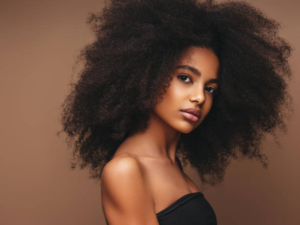 istock Beautiful smiling girl with curly hairstyle 1264169989