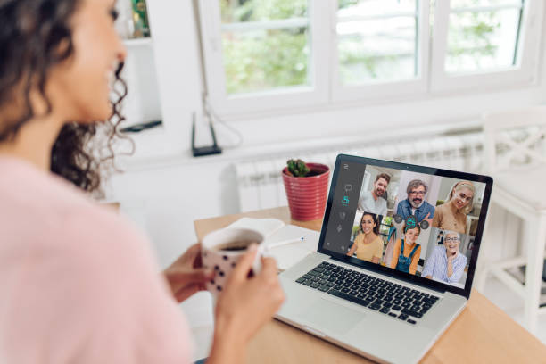 istock Young woman and her colleagues having a video conference 1264170589