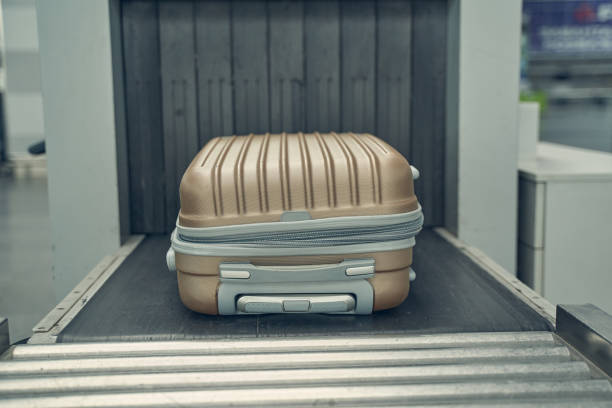istock Close up of suitcase that being under control 1264170810