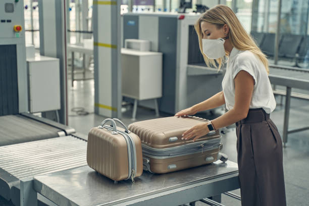 istock Attentive young female person opening her suitcase 1264170834