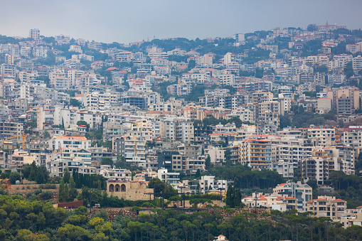 Dense development of Lebanese towns. Hills covered with a lot of houses. Panoramic view of villages in Lebanon