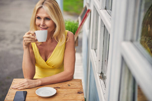 istock Pensive lady relaxing during the tea break 1264178630
