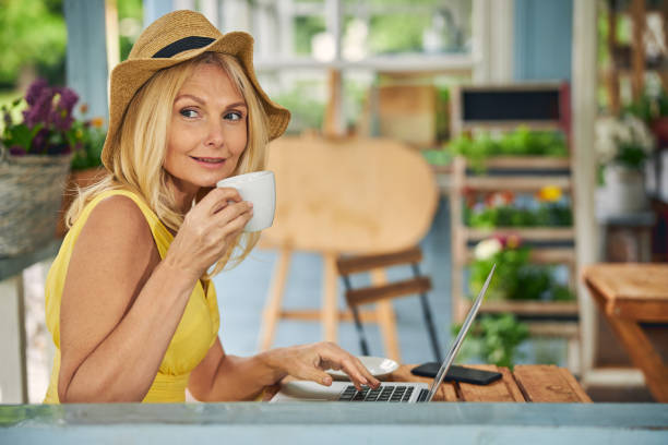 istock Attractive woman with a cup looking away 1264178680