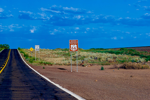 A section of West Old Highway 66, also known as “Historic Route 66”, between the towns of Seligman, Arizona, and Ash Fork, Arizona in late afternoon.
