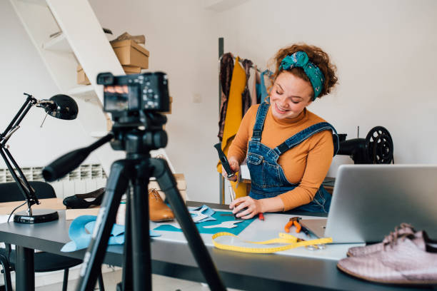 istock Young female shoemaker filming a video blog 1264181490