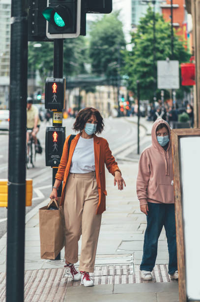 istock Mum and daughter in face mask are shopping 1264181742