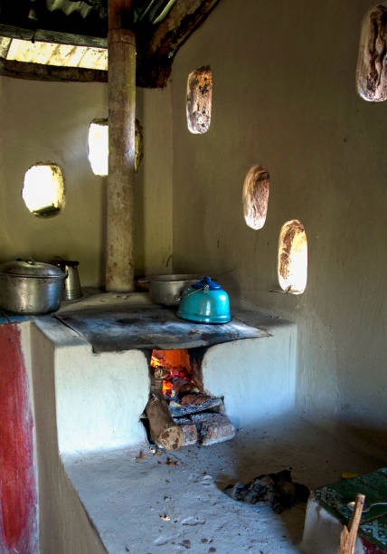 A traditional rural kitchen in Honduras. Natural light illuminating a traditional kitchen and stove made of clay adobe oven stock pictures, royalty-free photos & images
