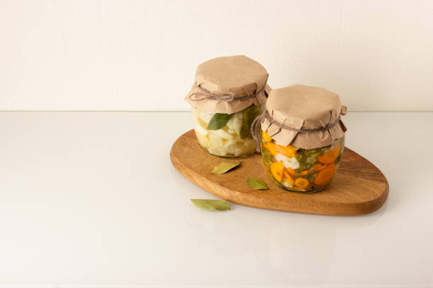 istock Canned vegetables in a jars: cauliflower, broccoli and carrot with spice. 1264183090