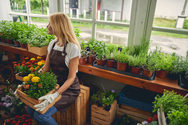 istock Dreamy blonde woman in work clothes looking away 1264183364