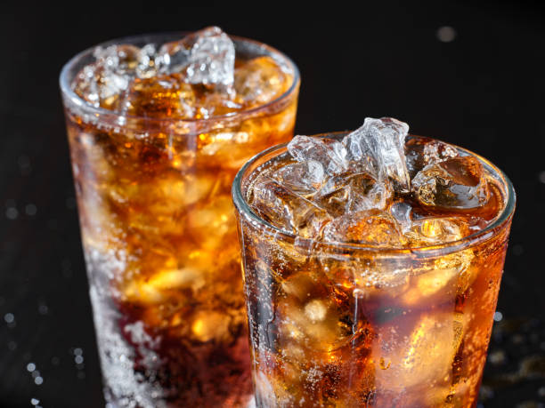 istock two cups of cold cola soft drink with ice 1264183456