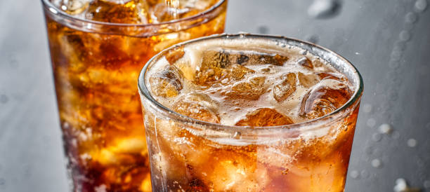 istock two cups of cold cola soft drink with ice 1264183483