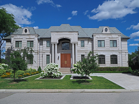 Toronto, Canada - August 5, 2020:  The Forest Hill neighborhood contains large detached houses with elegant landscaping.