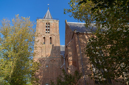 View on the romano-gothic protestant church of Burgum, The Netherlands from the 13th century. Also known as Cross Church, Saint Martin's church or Kruiskerk.