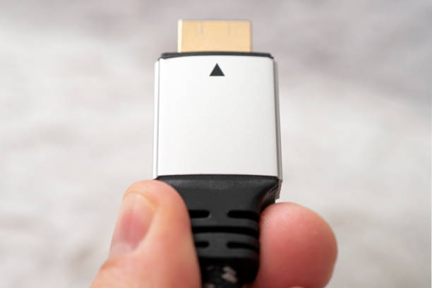istock High-speed 8K signal transmission. HDMI connector. hdmi high definition multimedia interface on hand 1264203599