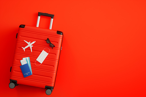 Christmas Travel Concept on Red Background