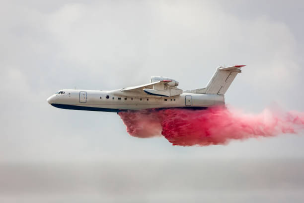 istock Big amphibious fire aircraft drops water 1264211936