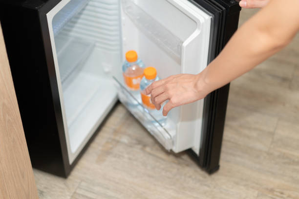 istock Woman hand taking water bottle from refrigerator. 1264213368