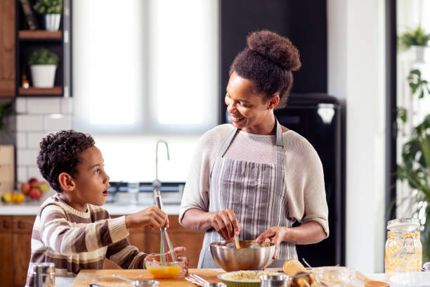 istock Mother with his son prepare pie in the kitchen 1264216189