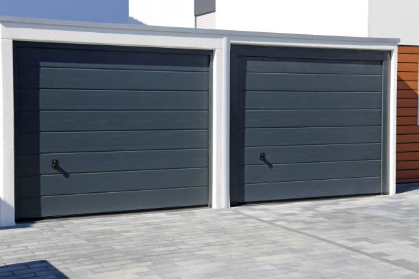 Two modern new garage doors (sectional doors) Two modern new garage doors (sectional doors) garage door opener photos stock pictures, royalty-free photos & images
