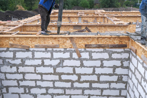 istock pouring concrete into the formwork at the construction site 1264220445