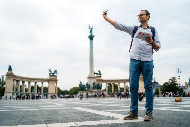 istock Young male tourist making selfies 1264220457