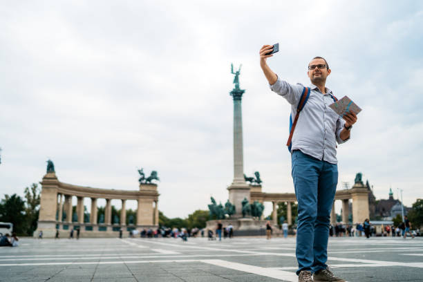 istock Young male tourist making selfies 1264220968