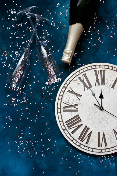 istock Champagne bottle and glasses  with Christmas  clock. Flat lay 1264221537