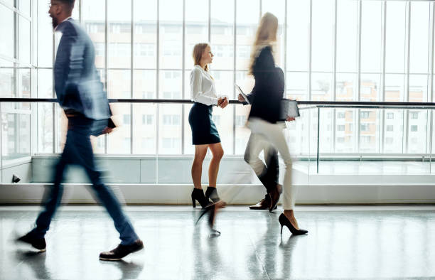 istock Business people walking along the corridor 1264223204