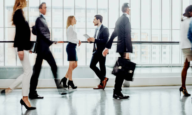 istock Business people walking along the corridor 1264223268