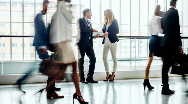 istock Business people walking along the corridor 1264223275
