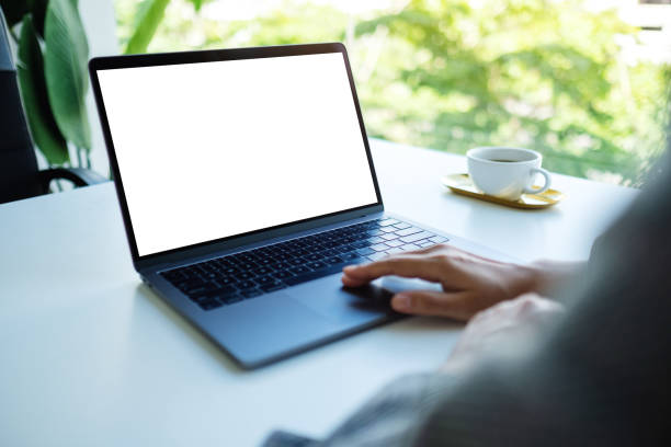 istock a businesswoman using and typing on laptop keyboard with blank white desktop screen in the office 1264223383