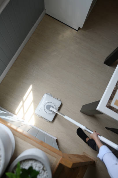 istock A young maid cleaning the house with a mop 1264225033