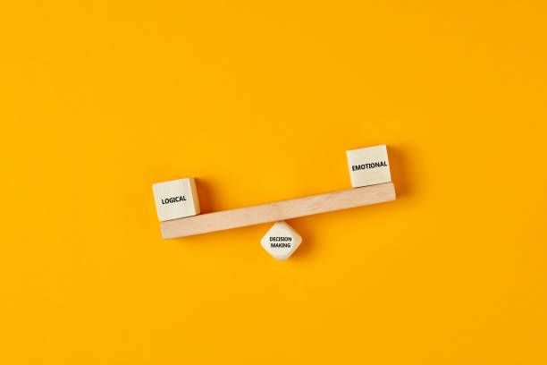istock Using logic rather than emotions in business decision making. Wooden blocks designed as a seesaw with logical and emotional text written. 1264225137