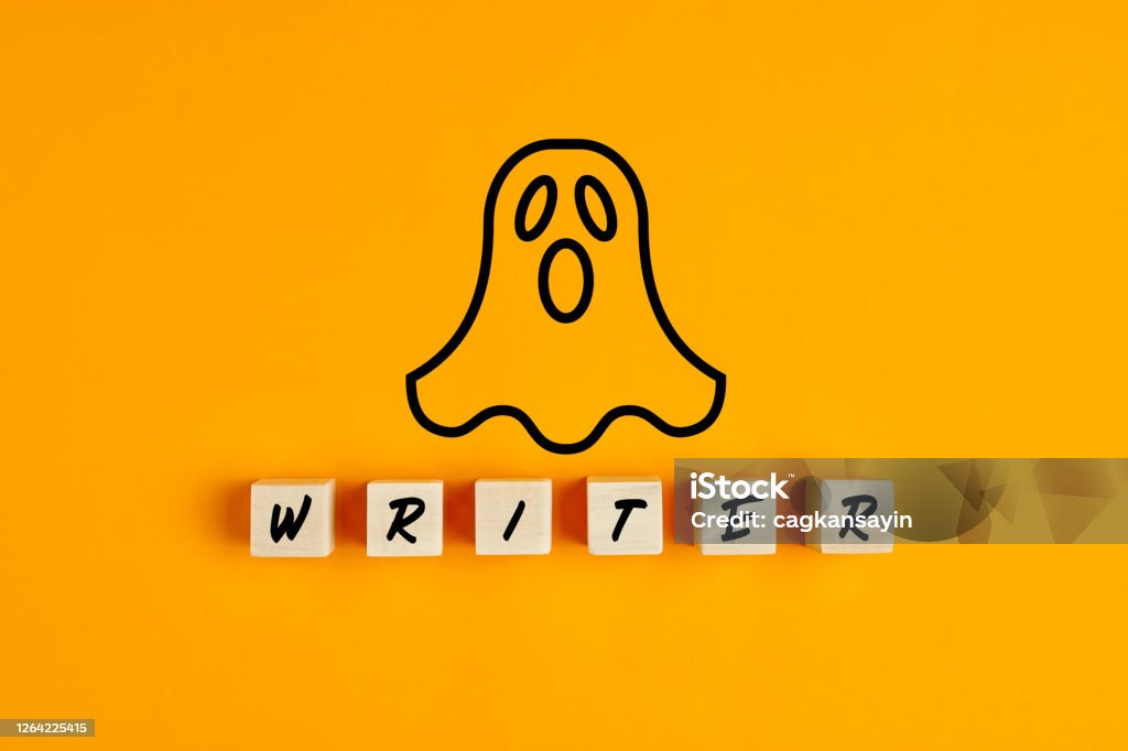 Ghostwriter concept with a ghost symbol and the word writer on wooden blocks Ghostwriter concept with a ghost symbol and the word writer on wooden blocks against yellow background. Ghost Stock Photo
