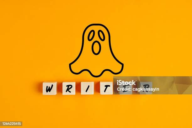 Ghostwriter Concept With A Ghost Symbol And The Word Writer On Wooden Blocks Stock Photo - Download Image Now
