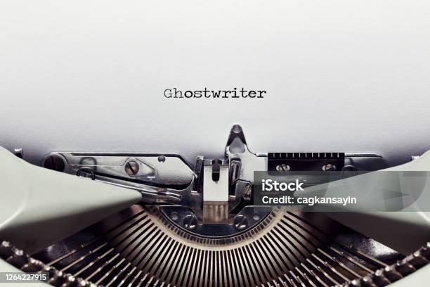 The Word Ghost Writer Typed On The Paper With A Vintage Typewriter Stock Photo - Download Image Now