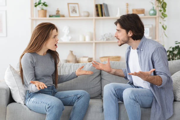 istock Angry married couple fighting, yelling at each ocher at home 1264229632
