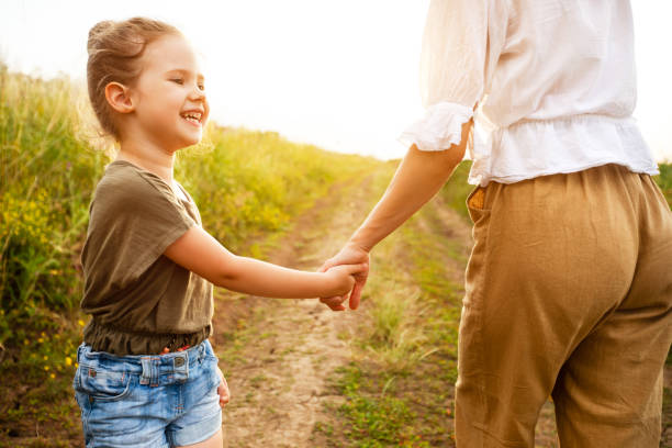 istock Mum taking her little daughter by the hand 1264229852