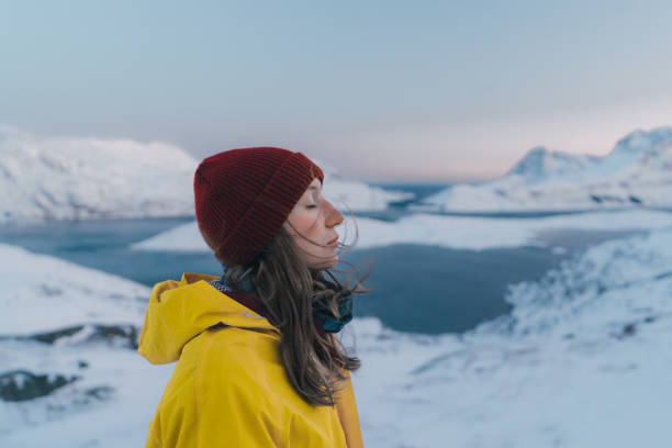 Photo of Woman in mountains on Lofoten island in snow
