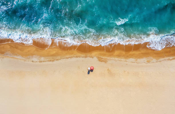 istock Tropical beach with colorful umbrellas. Picture with drone! 1264232904