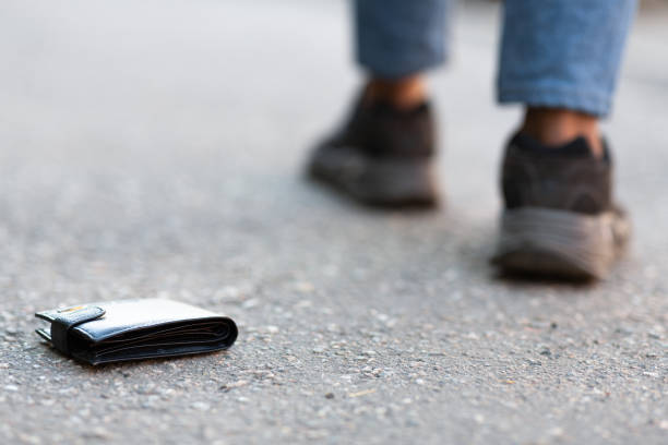 istock Man has lost his wallet on city street 1264235140