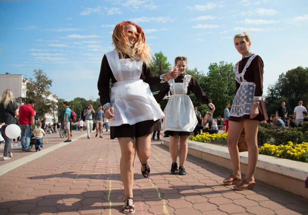 Belarus, the city of Gomel, September 15, 2018. Holiday City Day. Central Park.High school girls in Soviet school uniform