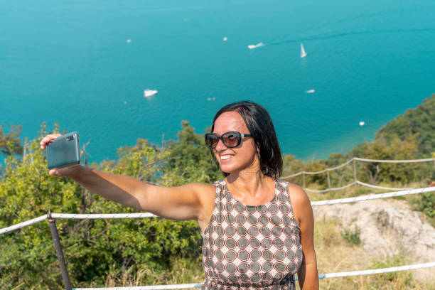 istock pretty woman take a selfie 1264237088