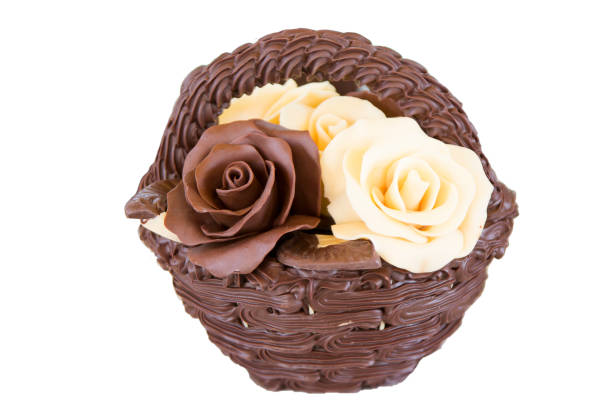 Products from chocolate basket with roses on a white background