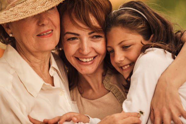 istock Three generations of hugs and endless love 1264240308
