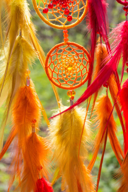 istock Handmade dream catcher with feathers threads and beads rope hanging 1264242748