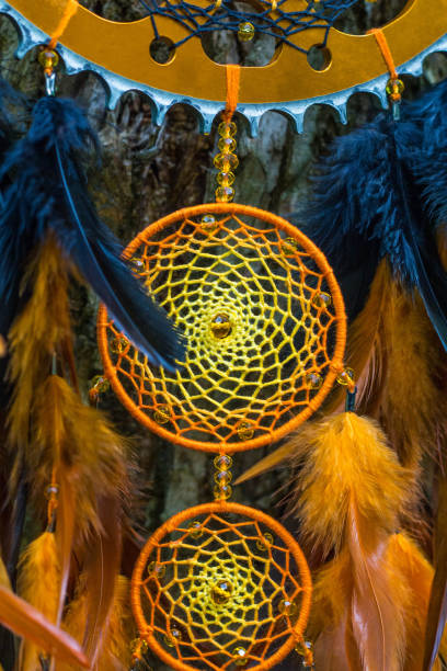 istock Handmade dream catcher with feathers threads and beads rope hanging 1264242813