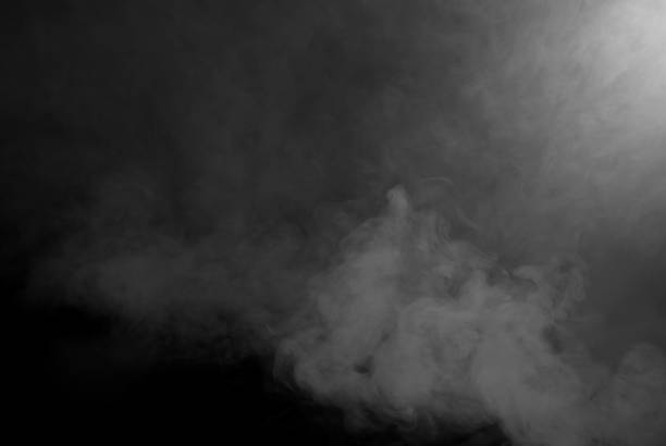 istock White smoke on a black background. The texture of scattered smoke. Blank for design. Layout for collages. 1264243365
